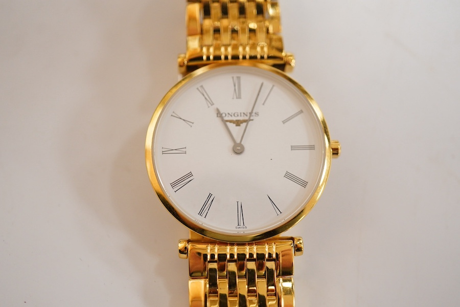 A lady's steel and gold plated Longines Le Grande Classique quartz wrist watch, white dial, case diameter 30mm, flexible link bracelet, boxed with papers.